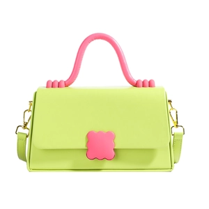 Fashionable lime green and pink contrast handbag with wave buckle and shoulder strap