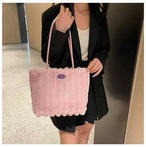 Detailed plush texture of pink tote bag with Fashion Girl logo and vertical stripes