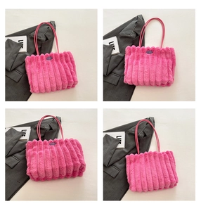 Detail of rose pink plush tote bag with vertical stripes and premium faux fur texture