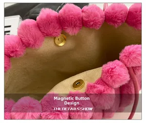Detail view of the pink faux fur tote bag showing the magnetic buckle closure and lining