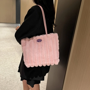 Pink plush tote bag with vertical stripes and faux fur texture for women's fashion