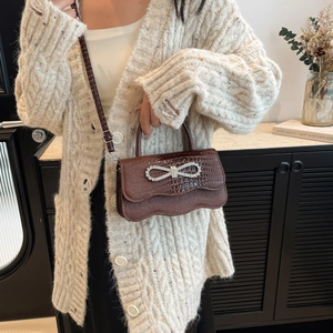 Brown crocodile embossed handbag with rhinestone bow and wavy flap for women