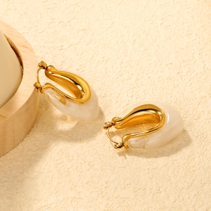 U-shaped resin hoop earrings in creamy white and gold with a marbled texture