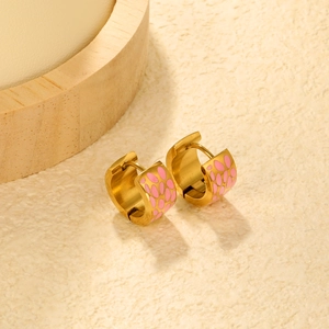 Detail of gold-plated bamboo hoop earrings with pink leopard print enamel inlay work