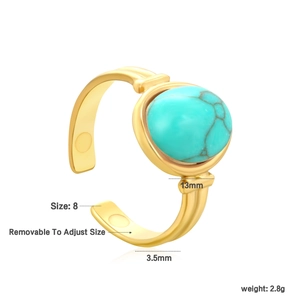 Detail showing vintage gold open ring with round turquoise stone and adjustable size features