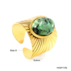 Detailed view of gold textured ring with green stone inlay showing size and weight info