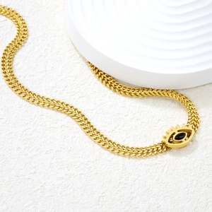 Golden double-layer chain necklace with devil's eye pendant and black gemstone