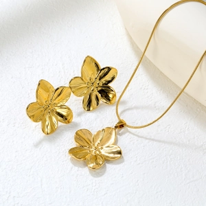 Golden spiral sun flower jewelry set with textured petal earrings and matching necklace