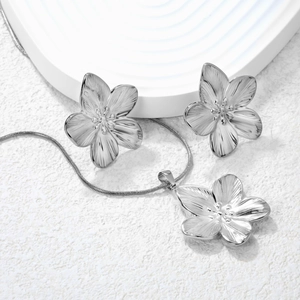 Elegant stainless steel jewelry set with petal pendant necklace and stud earrings