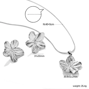 Detailed view of silver petal jewelry set showing dimensions and brushed metal texture