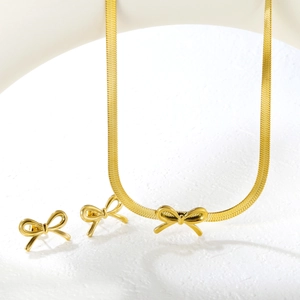 Golden stainless steel bow jewelry set featuring a sleek snake chain and stud earrings