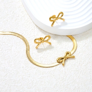 Golden butterfly jewelry set featuring a sleek snake chain necklace and matching stud earrings