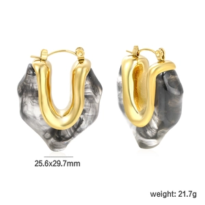 Detail of vintage heart-shaped resin earrings with gold U-shape accents and size info