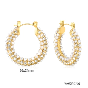Detail view of gold hoop earrings with white pearls and sparkling rhinestones 26x24mm