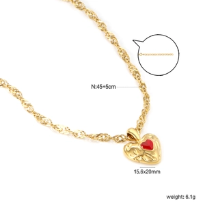 Detailed view of gold lava heart pendant with red inlay and 15.6x20mm dimensions