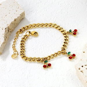 Gold stainless steel chain bracelet featuring three cherry pendants with red zircons
