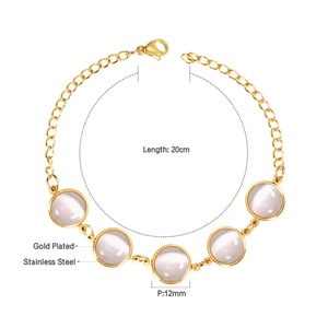 Macro detail of gold-plated stainless steel bracelet with 12mm pink cat eye stones