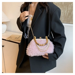 Detail of pink faux fur shell bag with bamboo handle and elegant pearl chain