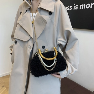 Faux shearling shell bag with bamboo handle, pearl chain and crossbody strap in black