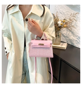 Pink sequin patchwork mini handbag styled with a beige trench coat for an elegant look
