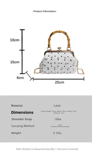 Detailed view of lace handbag with pearl decor, bamboo handle and gold chain strap