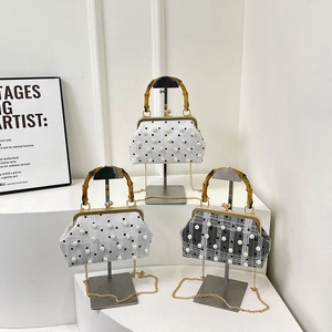 Chic bamboo handle handbag with pearl accents and chain strap in three vintage colors
