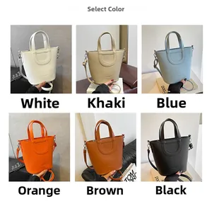 Litchi texture leather bucket bag shown in white, khaki, blue, orange, brown, and black