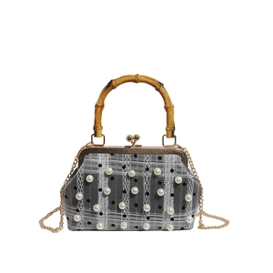 Vintage style bamboo handle handbag with pearl lace overlay and gold chain strap