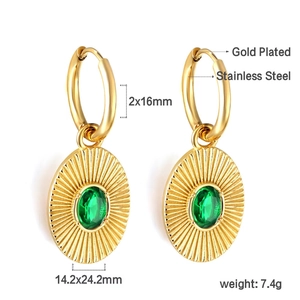 Detail of gold plated stainless steel earrings with oval green stone and sunray texture