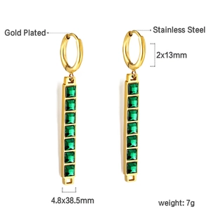 Detailed view of gold-plated stainless steel earrings with square green crystal settings