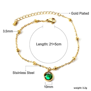 Detail of gold plated stainless steel anklet with green gem pendant and size specs