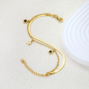 Bracelet double rang en acier inoxydable doré avec étoiles émaillées noires et blanches