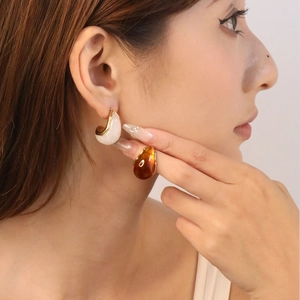 French vintage resin hoop earrings with amber swirl and ivory gold-edged design