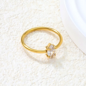 Close-up of a marquise-cut white zircon set in a minimalist gold stainless steel ring