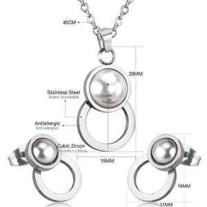 Detailed view of stainless steel jewelry set featuring faux pearls and cubic zirconia