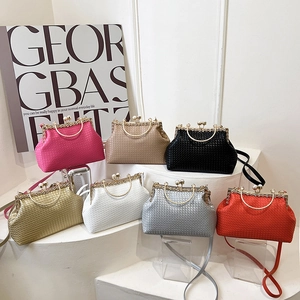 Collection of retro woven clutch bags with pearl clasps in multiple vibrant colors