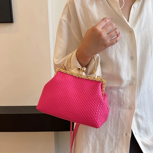 Elegant rose red woven handbag with vintage metal frame and pearl clasp detail