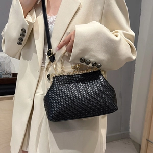 Retro black woven handbag with pearl clasp closure and elegant gold handle crossbody strap