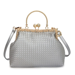 Silver woven handbag with gold pearl handle and diamond clasp for evening parties