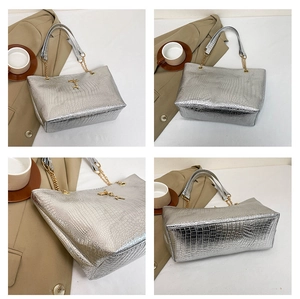 Detailed views of a silver crocodile pattern tote bag with gold chain handles and accents