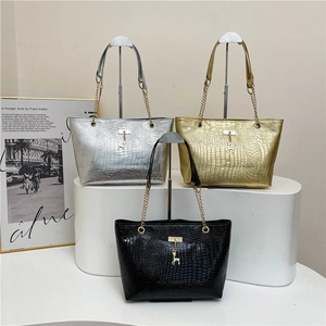 Crocodile pattern handbags with gold chains and deer pendants in black gold and silver