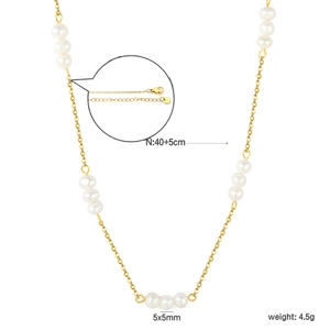 Detail of gold stainless steel necklace with fresh water pearls and lobster clasp