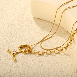 Gold-plated double-layer necklace with oval pendant and toggle clasp on white background