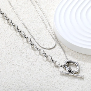 Silver layered necklace set with heavy chain, snake chain, and irregular OT buckle