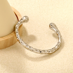 Minimalist silver hammered stainless steel open cuff bracelet with unique texture
