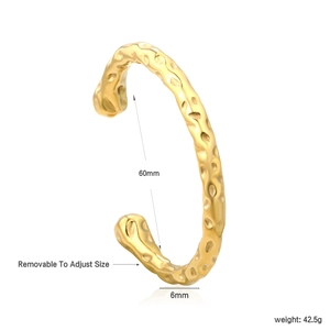 Detail of adjustable gold hammered texture bangle showing 60mm diameter and 6mm width