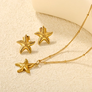 Golden starfish jewelry set with textured pendant necklace and matching stud earrings