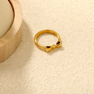 Minimalist 18K gold plated stainless steel bow ring with a polished metallic finish