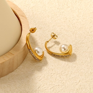 Elegant gold C-shaped hoop earrings with pearls and rows of sparkling white crystals