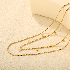 Collar de doble capa en acero inoxidable chapado en oro 18K con dijes de diamantes